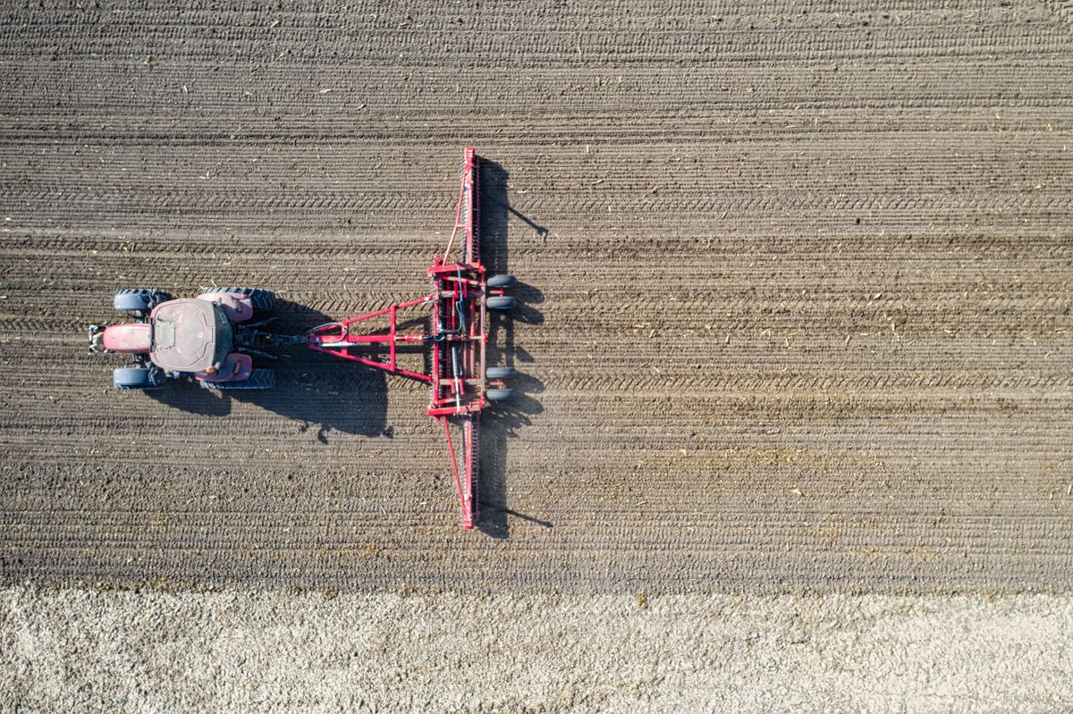 Tractor cultivating a field