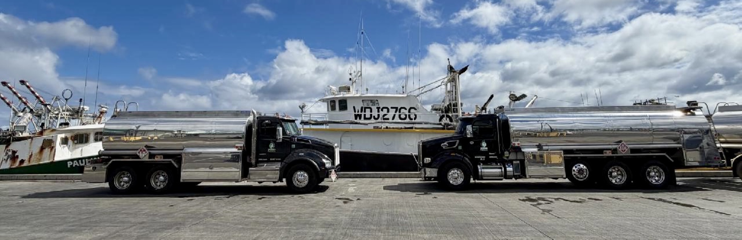 Pono Petroleum fuel trucks at a harbor dock